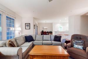 a living room with a couch and a coffee table at Bear Trap Dunes - 112A Willow Oak Ave in Ocean View