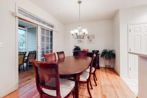 a dining room with a wooden table and chairs at Bear Trap Dunes - 112A Willow Oak Ave in Ocean View +41 photos