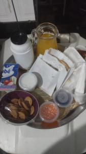 a plate of food on a table with food at Hotel Master Blue - Brasília in Ceilândia