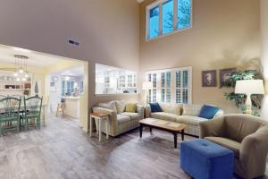 a living room with two couches and a dining room at Sea Colony - 56182 Pine Branch Way in Bethany Beach