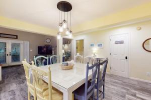 a kitchen and dining room with a table and chairs at Sea Colony - 56182 Pine Branch Way in Bethany Beach