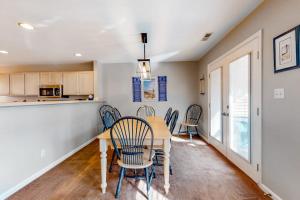 a kitchen and dining room with a table and chairs at Sea Colony - 56184 Pine Branch Way in Bethany Beach