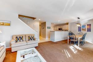 a living room with a couch and a table at Sea Colony - 56184 Pine Branch Way in Bethany Beach +43 photos
