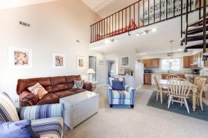 a living room with a couch and a table at Sea Colony - 2805 Center Ct in Bethany Beach