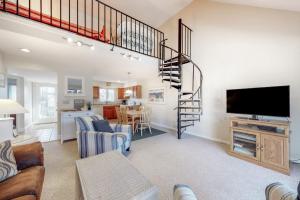 a living room with a staircase and a living room at Sea Colony - 2805 Center Ct in Bethany Beach