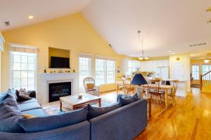 a living room with a couch and a fireplace at Bear Trap Dunes - 2 October Glory in Ocean View