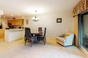 a kitchen and dining room with a table and chairs at Sea Colony - 1804 Doubles in Bethany Beach +33 photos
