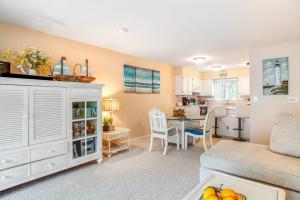 a living room with a couch and a table at Sea Colony - 3306 Round Robin Way in Bethany Beach +42 photos