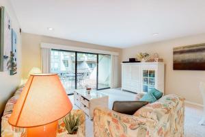a living room with a couch and a table at Sea Colony - 3306 Round Robin Way in Bethany Beach