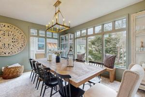 a dining room with a large wooden table and chairs at Sea Colony - 58011 Wimbledon in Bethany Beach