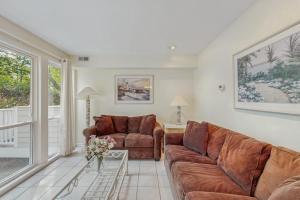 a living room with a couch and a table at Sea Colony - 2004 Doubles in Bethany Beach