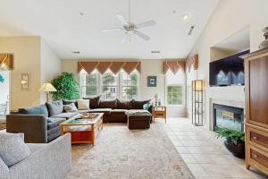 a living room with a couch and a fireplace at Bear Trap Dunes - 1D Clubhouse in Ocean View