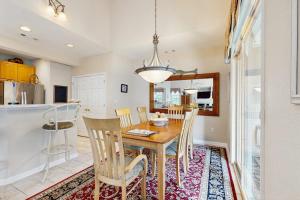 a kitchen and dining room with a table and chairs at Bear Trap Dunes - 1D Clubhouse in Ocean View +33 photos