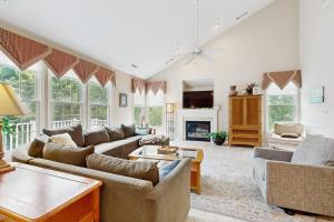 a living room with two couches and a fireplace at Bear Trap Dunes - 1D Clubhouse in Ocean View