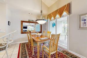a dining room with a table and chairs at Bear Trap Dunes - 1D Clubhouse in Ocean View