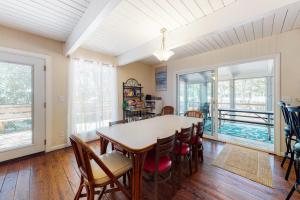 a dining room with a table and chairs at Bethany West - 609 Brookview in Bethany Beach