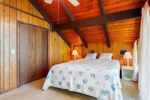 a bedroom with a bed and a wooden ceiling at Bethany West - 609 Brookview in Bethany Beach +27 photos