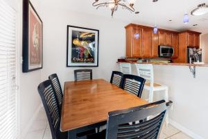 a dining room with a wooden table and chairs at Sea Colony - 56032 Great Pine in Bethany Beach