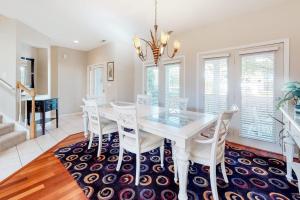 a dining room with a white table and chairs at Sea Colony - 56032 Great Pine in Bethany Beach