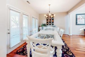 a dining room with a white table and chairs at Sea Colony - 56032 Great Pine in Bethany Beach