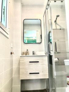 a bathroom with a sink and a mirror at Vilasardemarlux1 in Vilassar de Mar +22 photos