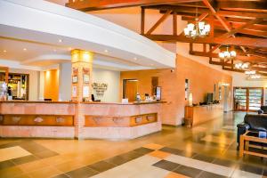 a lobby with a bar in a building at Nobile Hotel Papillon in Bella Vista +74 photos