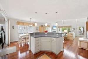 a kitchen and living room with a large island at Bethany West -- 719 Fenwood in Bethany Beach