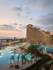 a view of a resort with a large pool at 2BR Sea View Chalet Porto sokhna in Ain Sokhna