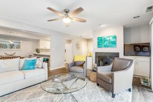 a living room with a white couch and chairs at Eagles Landing I --- 260 Sea Eagle Dr Unit 7 in Rehoboth Beach