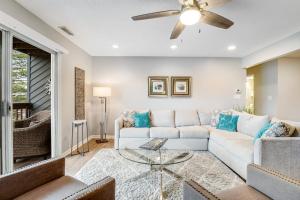 a living room with a couch and a ceiling fan at Eagles Landing I --- 260 Sea Eagle Dr Unit 7 in Rehoboth Beach