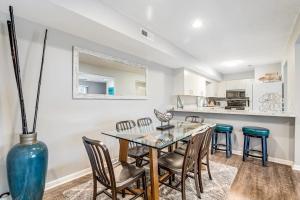 a dining room with a glass table and chairs at Eagles Landing I --- 260 Sea Eagle Dr Unit 7 in Rehoboth Beach +21 photos