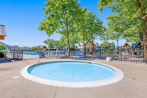 an empty swimming pool in a park with a playground at Bear Trap Dunes - 60 Willow Oak in Ocean View