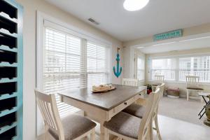 a dining room with a wooden table and chairs at West Fenwick --- 39110 Van Buren Ave in Selbyville