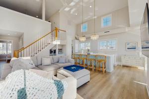 a living room with a couch and a table at South Bethany --- 102 Brandywine Dr in Bethany Beach