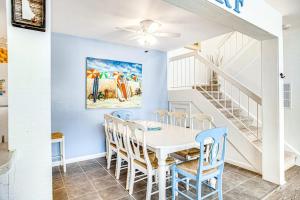a dining room with a white table and chairs at Sea Colony - 903 Singles Ct in Bethany Beach
