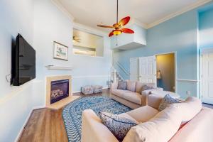a living room with a couch and a fireplace at Bayside at Bethany Lakes #143 in Ocean View