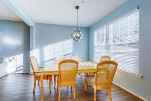 a dining room with a table and chairs at Bayside at Bethany Lakes #143 in Ocean View +40 photos