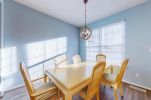 a dining room with a table and chairs at Bayside at Bethany Lakes #143 in Ocean View