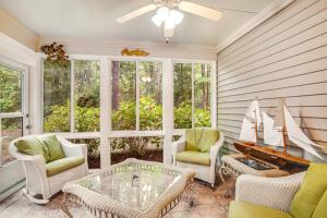 a living room with a table and chairs and a piano at Sea Colony - 52028 Canal Ct in Bethany Beach