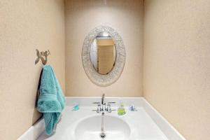 a bathroom with a sink and a mirror at Sea Colony - 52028 Canal Ct in Bethany Beach +28 photos