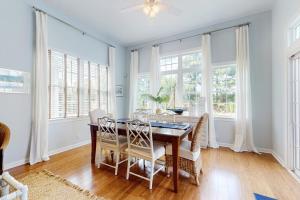 a dining room with a table and chairs at Bear Trap Dunes --- 34 Sycamore Street in Ocean View