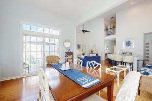 a dining room and living room with a table at Bear Trap Dunes --- 34 Sycamore Street in Ocean View