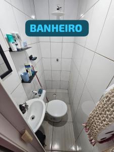 a small bathroom with a sink and a toilet at Condomínio top in São Paulo