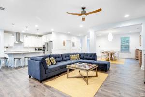 a living room with a blue couch and a table at Bethany West --- 557 Fairway in Bethany Beach