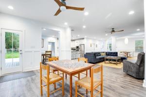 a dining room and living room with a table and chairs at Bethany West --- 557 Fairway in Bethany Beach