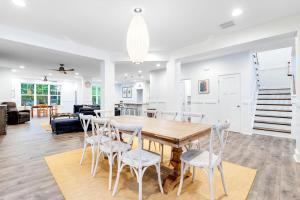 a kitchen and living room with a wooden table and chairs at Bethany West --- 557 Fairway in Bethany Beach