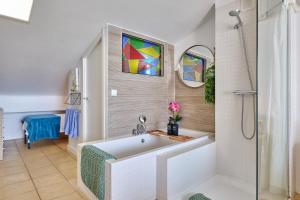 a bathroom with a tub and a shower at Calatabarca B&B in Tabarca +146 photos