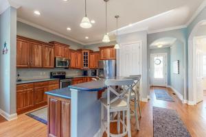 a kitchen with wooden cabinets and a blue counter top at Bayside Resort - 36486 Wild Rose in Selbyville