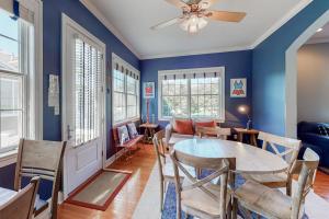 a dining room with blue walls and a table and chairs at Bayside Resort - 36486 Wild Rose in Selbyville