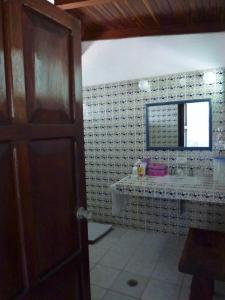 a bathroom with a sink and a mirror at BeachCasaDonPepe in Barra de Potosi +39 photos